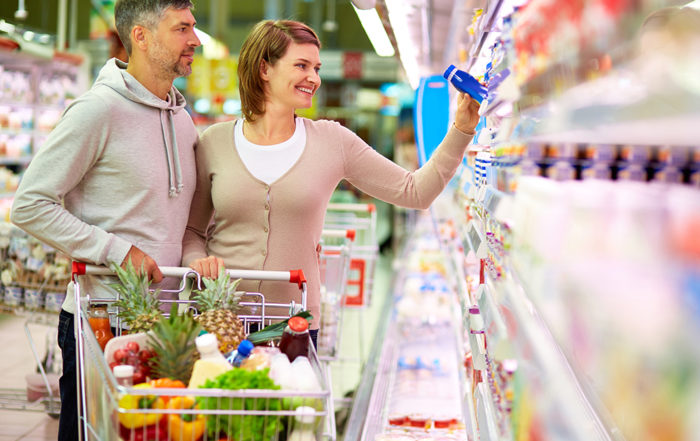 man and woman grocery shopping