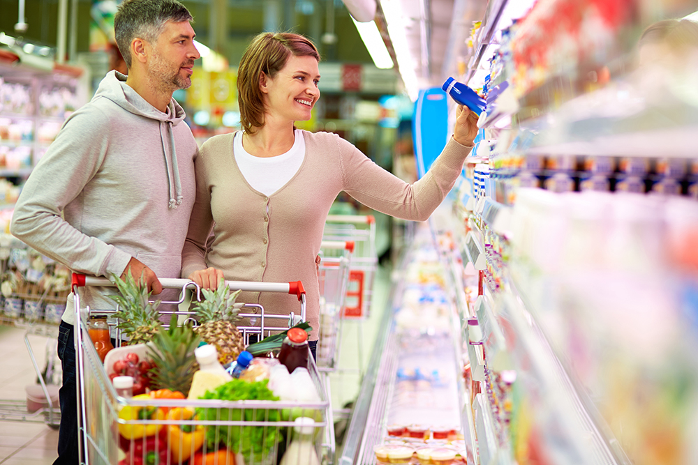 man and woman grocery shopping